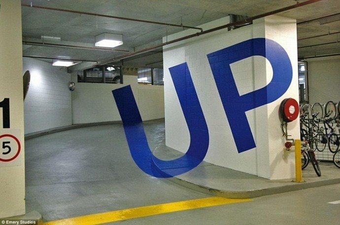 A car park in Australia has indicators made of letters which jump out of the surroundings. 