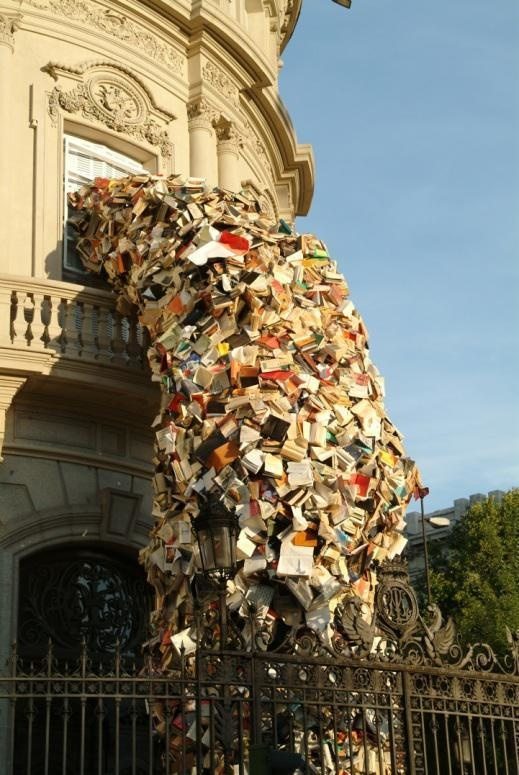 Madrid-based artist Alicia Martin designed a tower of books pouring out of the window into the street. 