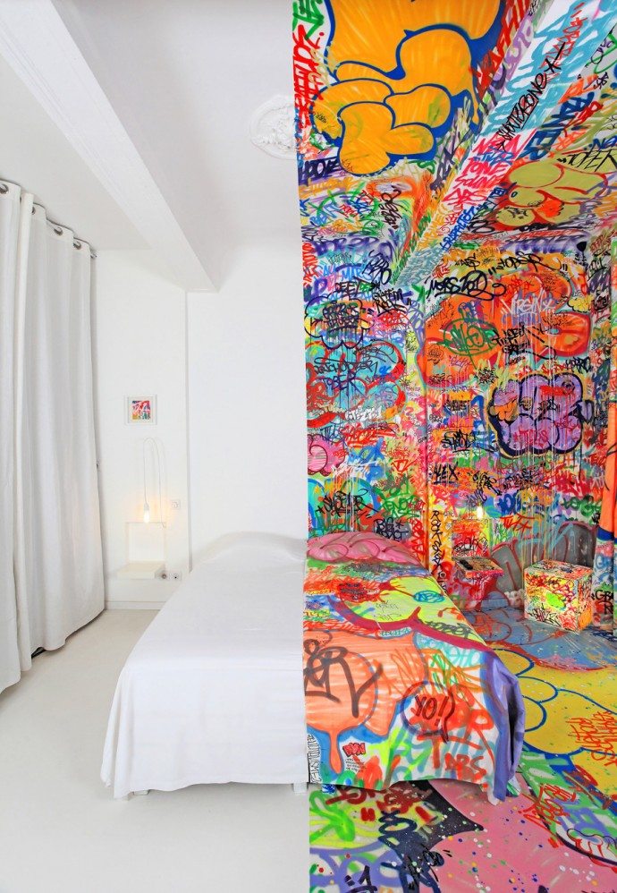 Half of a Marseille hotel room has been swamped in decoration by French graffiti artist Tilt, while the other half stays purely white. 