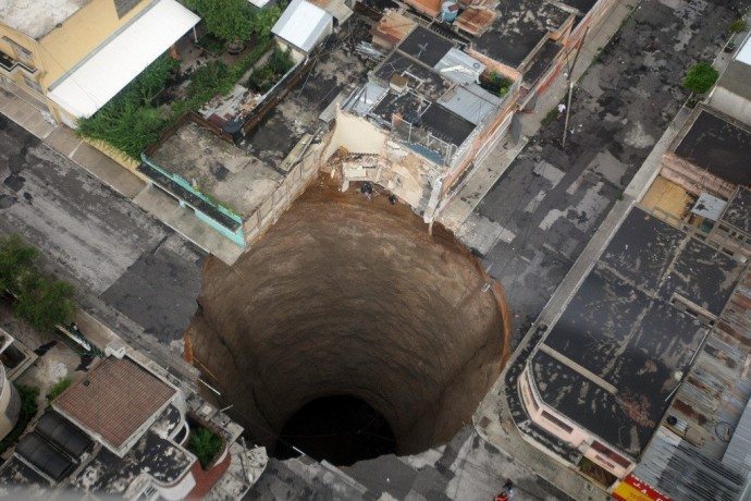Apocalyptic as it may look, this sinkhole appeared in Guatemala City in 2010. It is 60 feet wide and 200 feet deep. 